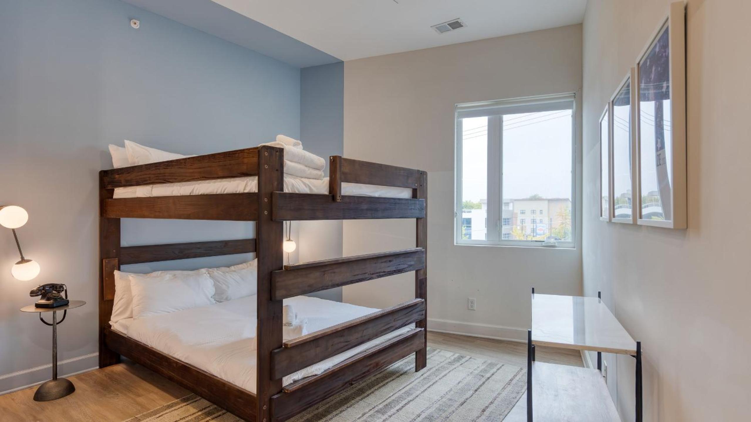 Sleeps 44 4 themed lofts w skyline balconies neon backdrops glam kitchens—perfect for Nashville group stays The Swift Retreat by AvantStay