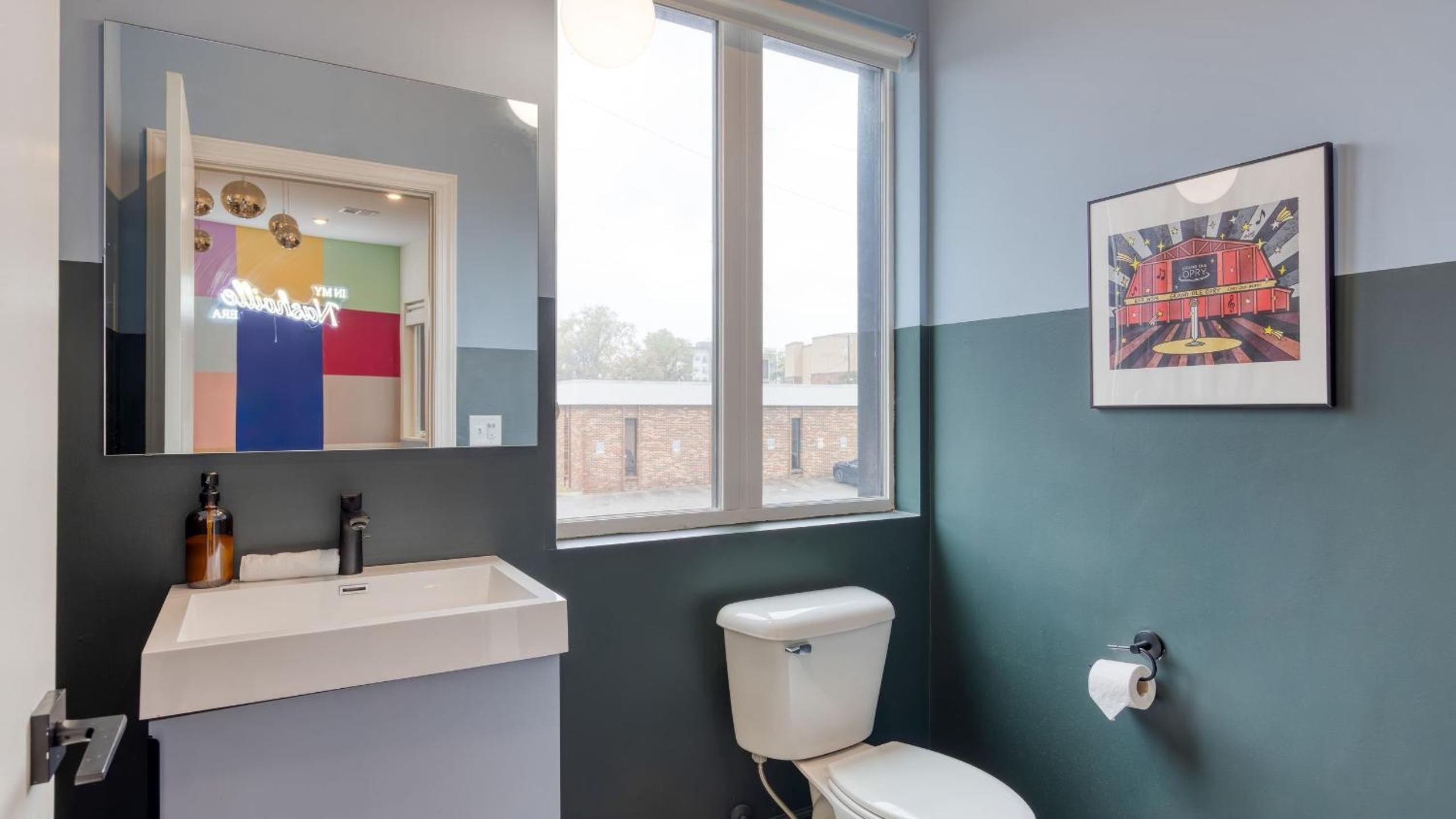 Sleeps 44 4 themed lofts w skyline balconies neon backdrops glam kitchens—perfect for Nashville group stays The Swift Retreat by AvantStay