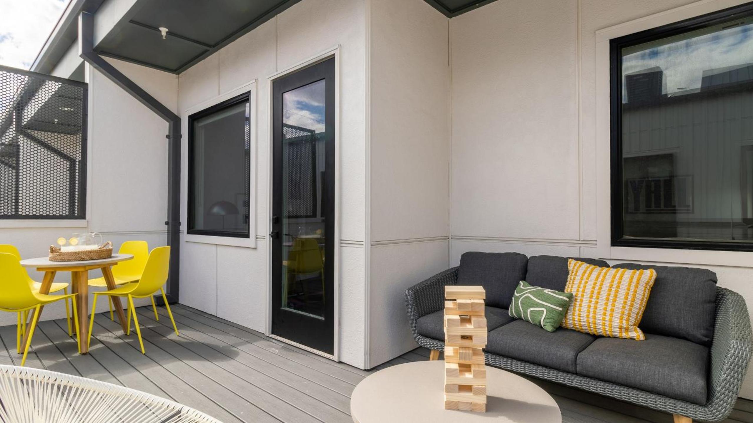 Sleeps 44 4 themed lofts w skyline balconies neon backdrops glam kitchens—perfect for Nashville group stays The Swift Retreat by AvantStay