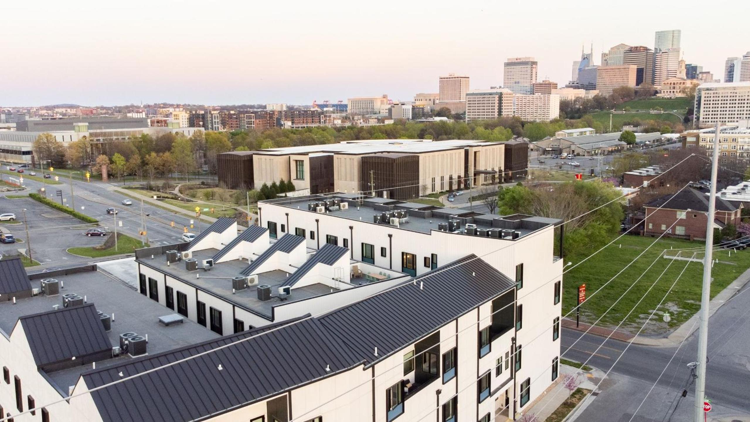 Sleeps 44 4 themed lofts w skyline balconies neon backdrops glam kitchens—perfect for Nashville group stays The Swift Retreat by AvantStay