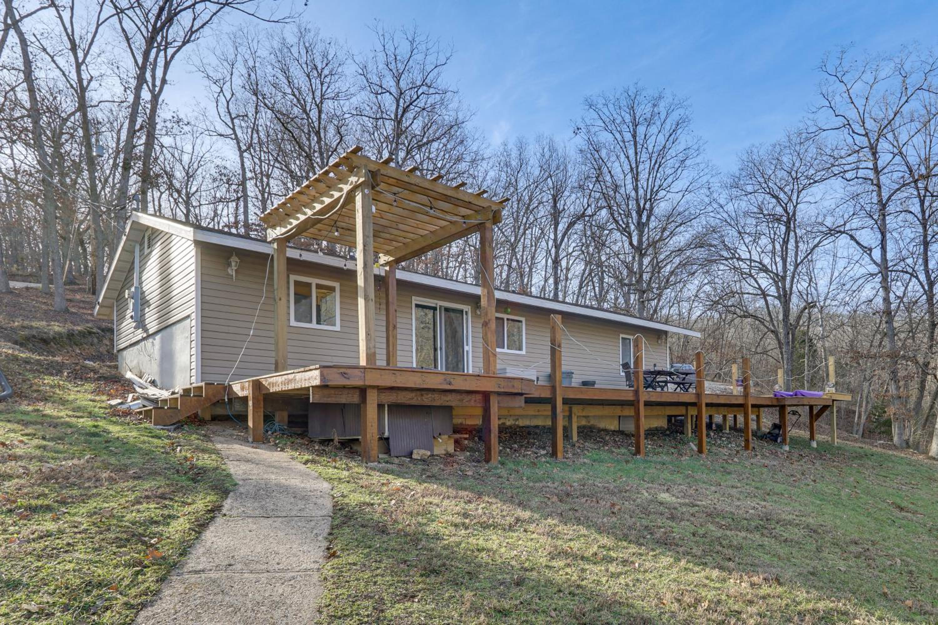 Lake Ozarks Home with Deck, Dock and Hot Tub