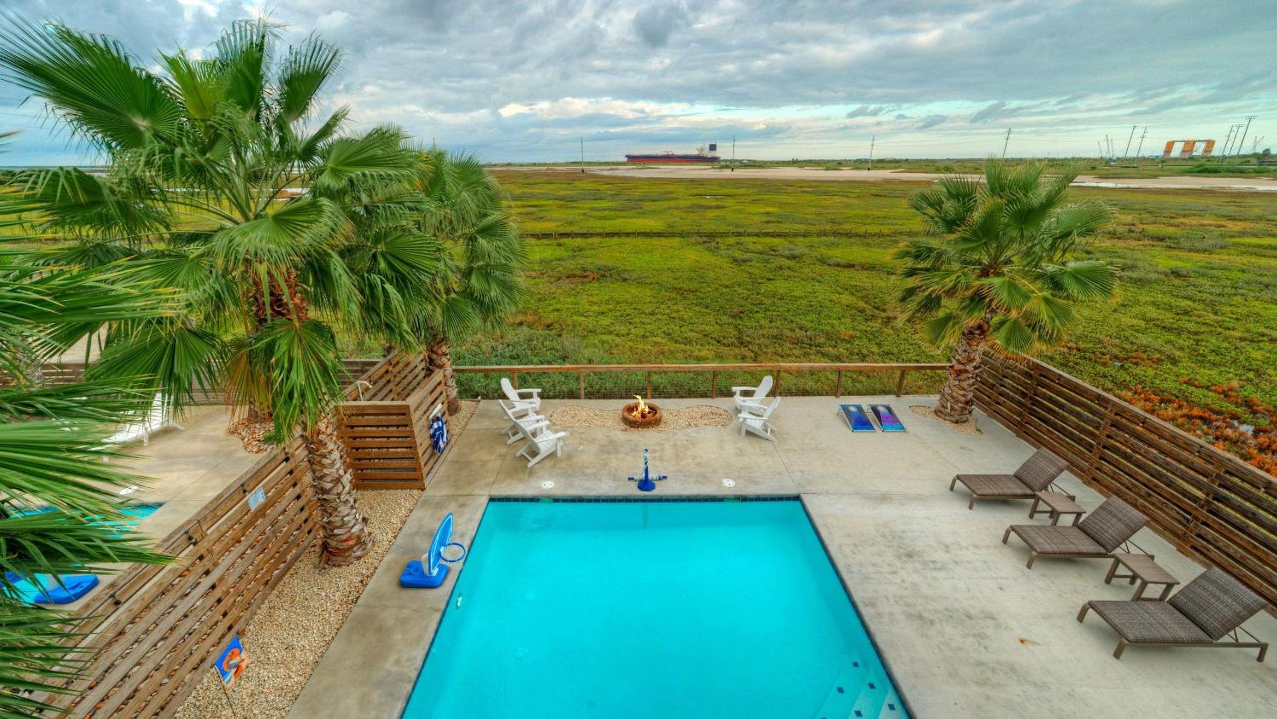 Bayfront Home w Pool Game Room Walk to Beach Golf Cart Access Pelican’s Perch by AvantStay