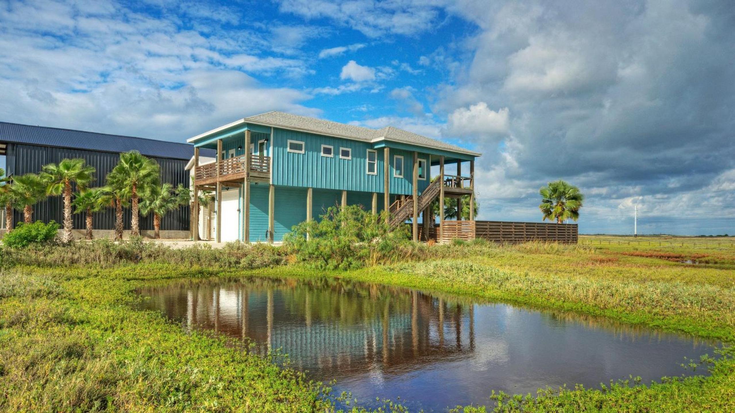 Bayfront Home w Pool Game Room Walk to Beach Golf Cart Access Pelican’s Perch by AvantStay