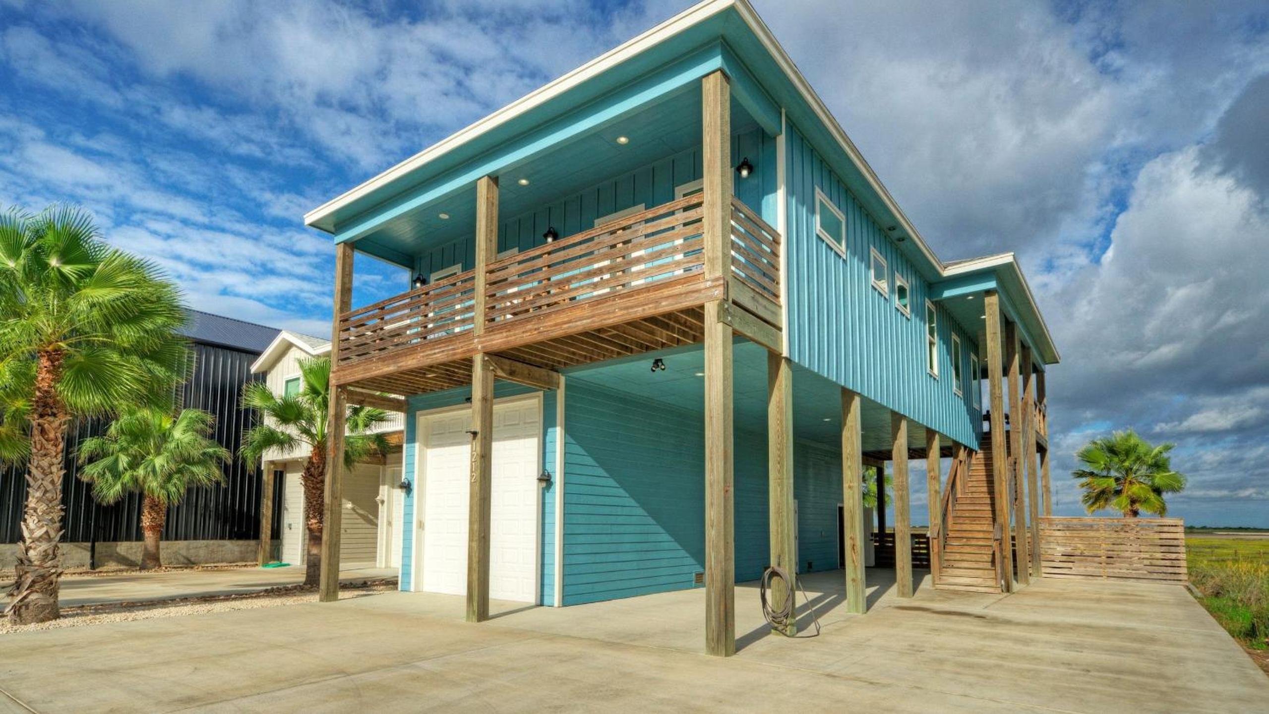 Bayfront Home w Pool Game Room Walk to Beach Golf Cart Access Pelican’s Perch by AvantStay
