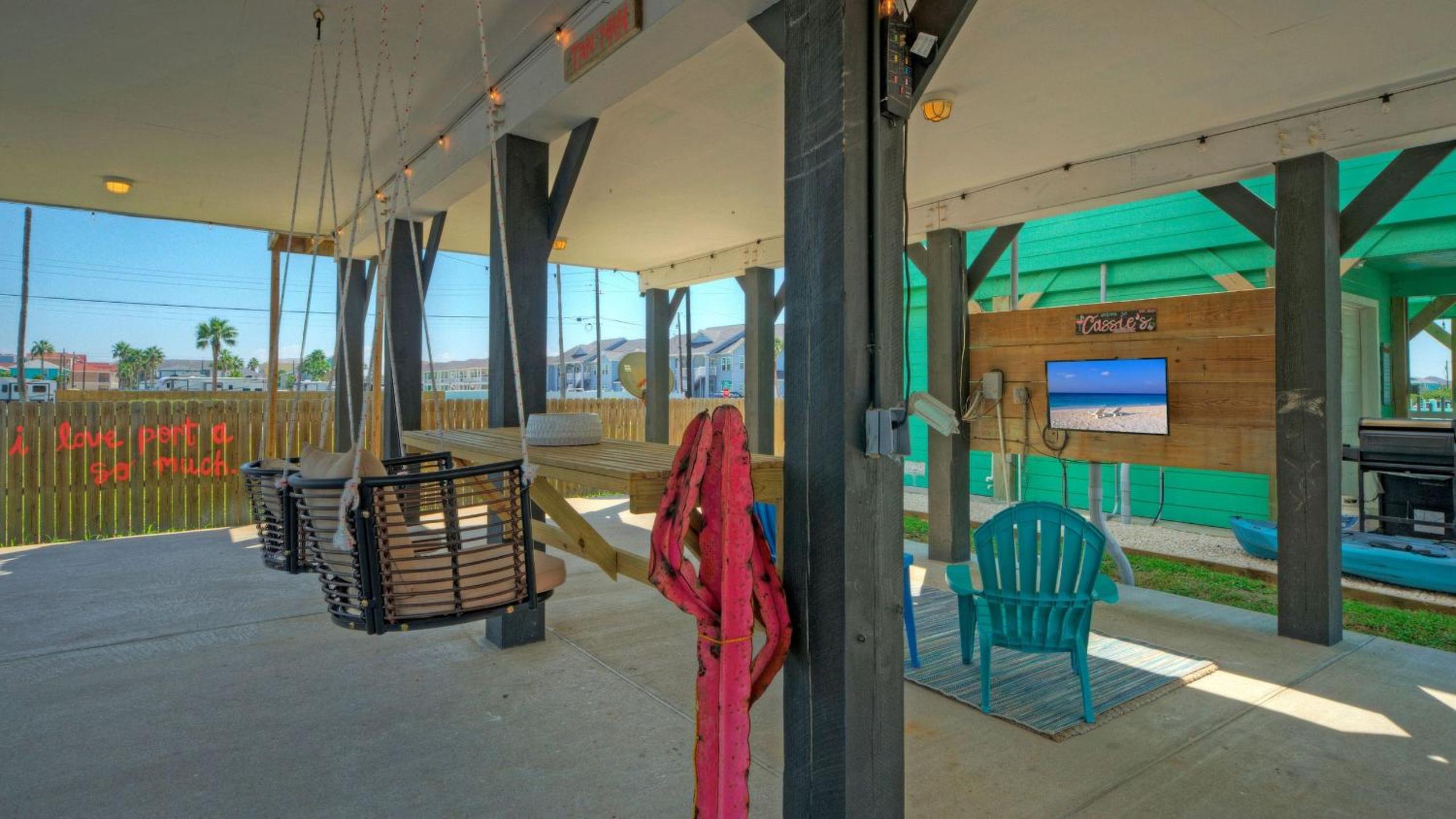 Bright Coastal Escape w Games Swing Chairs Minutes to Port A Beach Captain Kirk by AvantStay