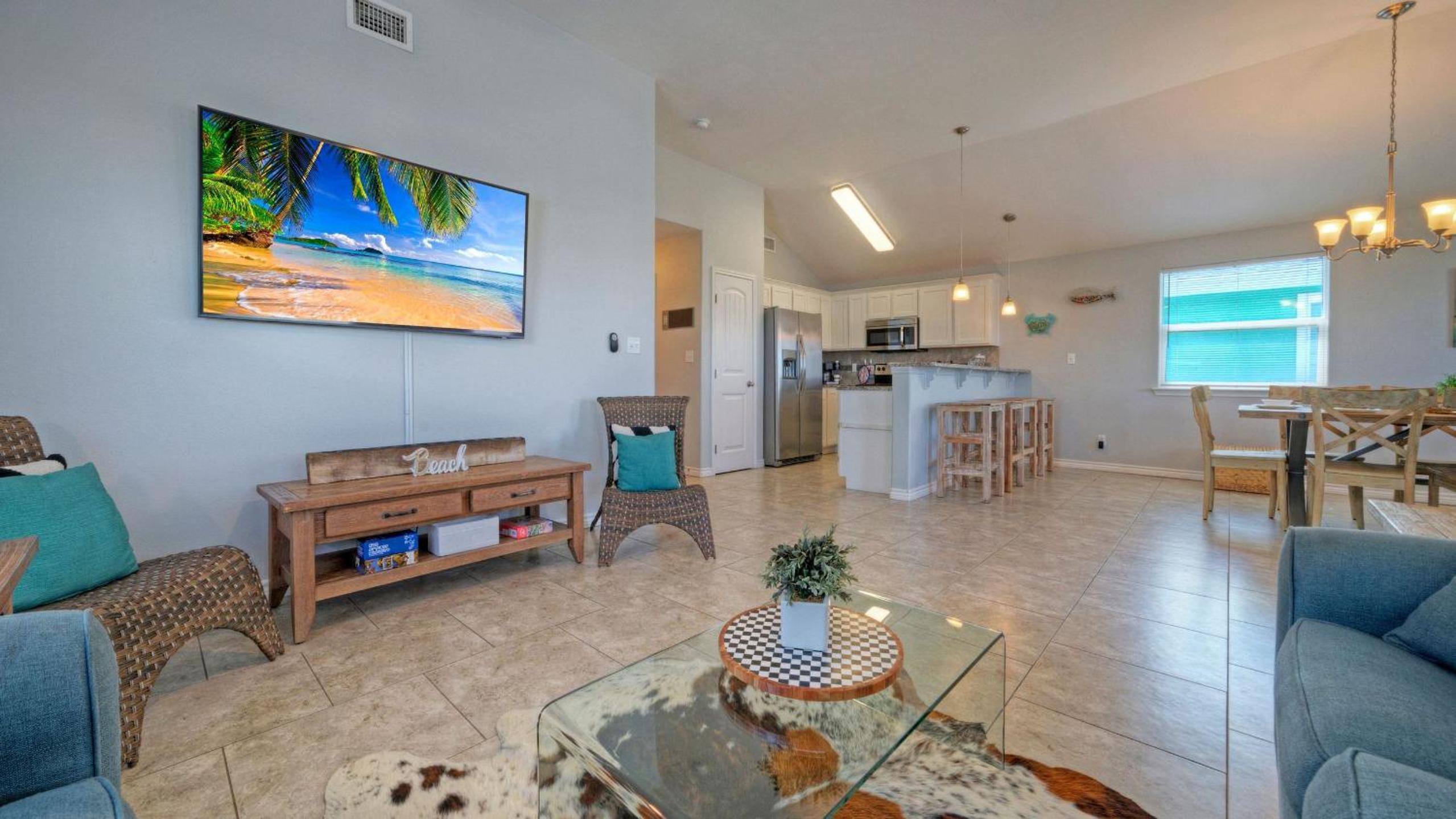 Bright Coastal Escape w Games Swing Chairs Minutes to Port A Beach Captain Kirk by AvantStay