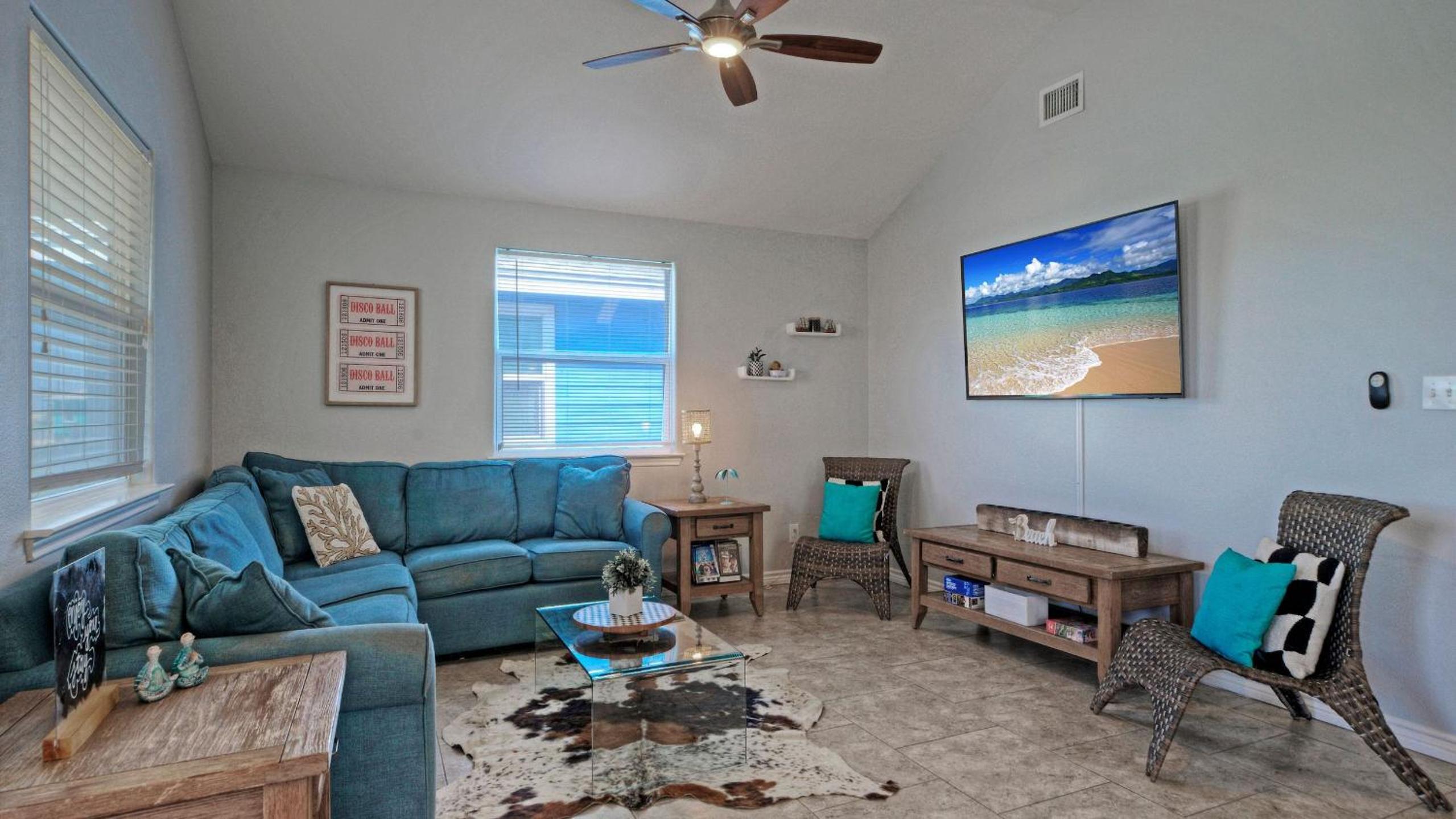 Bright Coastal Escape w Games Swing Chairs Minutes to Port A Beach Captain Kirk by AvantStay