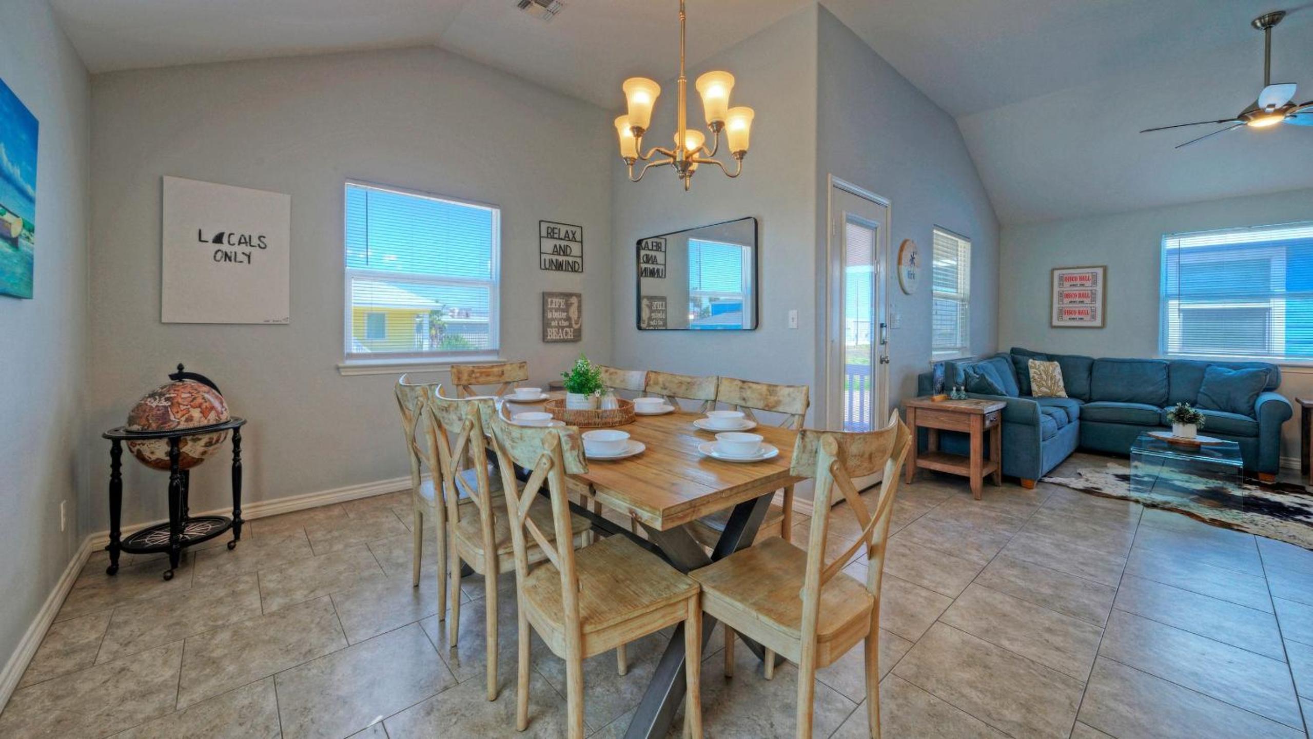 Bright Coastal Escape w Games Swing Chairs Minutes to Port A Beach Captain Kirk by AvantStay