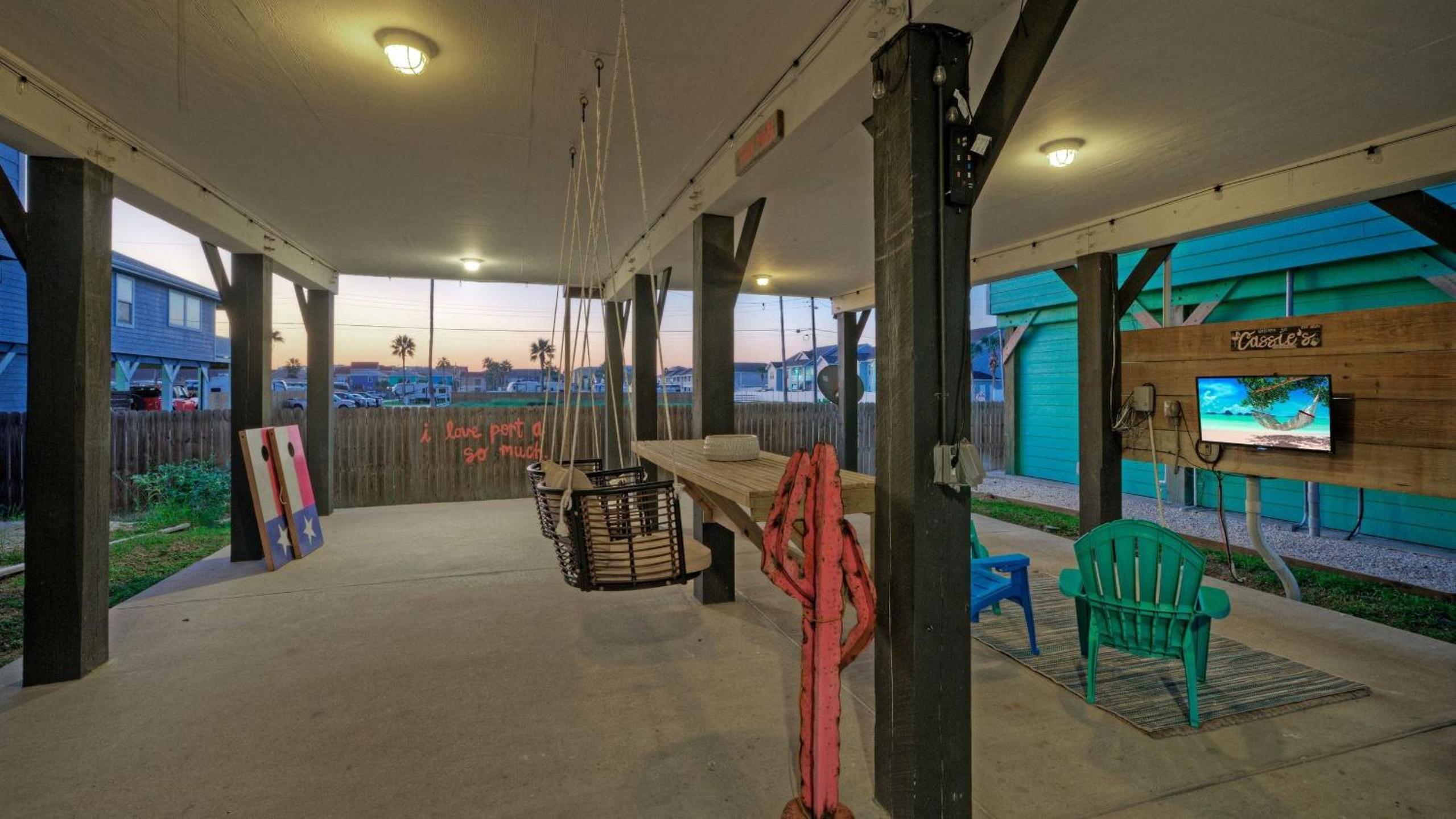 Bright Coastal Escape w Games Swing Chairs Minutes to Port A Beach Captain Kirk by AvantStay