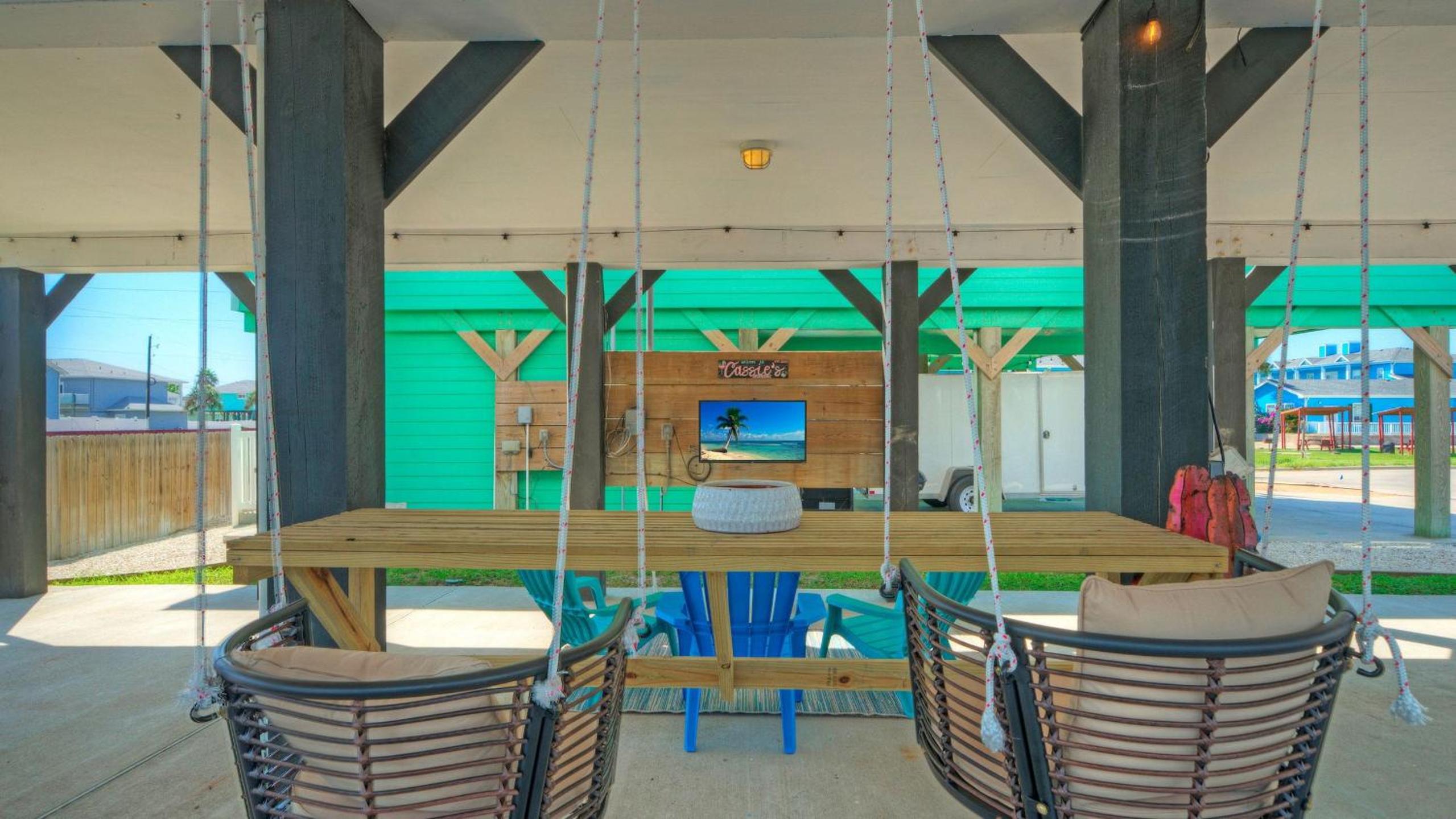 Bright Coastal Escape w Games Swing Chairs Minutes to Port A Beach Captain Kirk by AvantStay