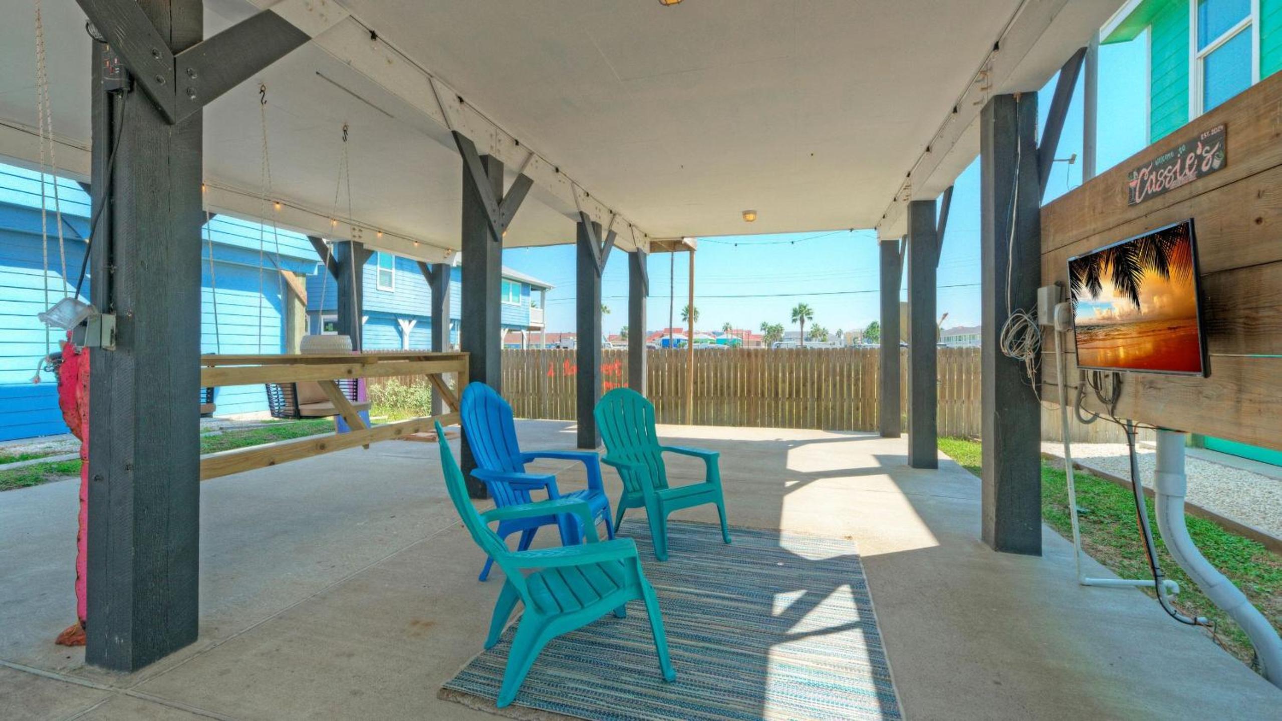 Bright Coastal Escape w Games Swing Chairs Minutes to Port A Beach Captain Kirk by AvantStay