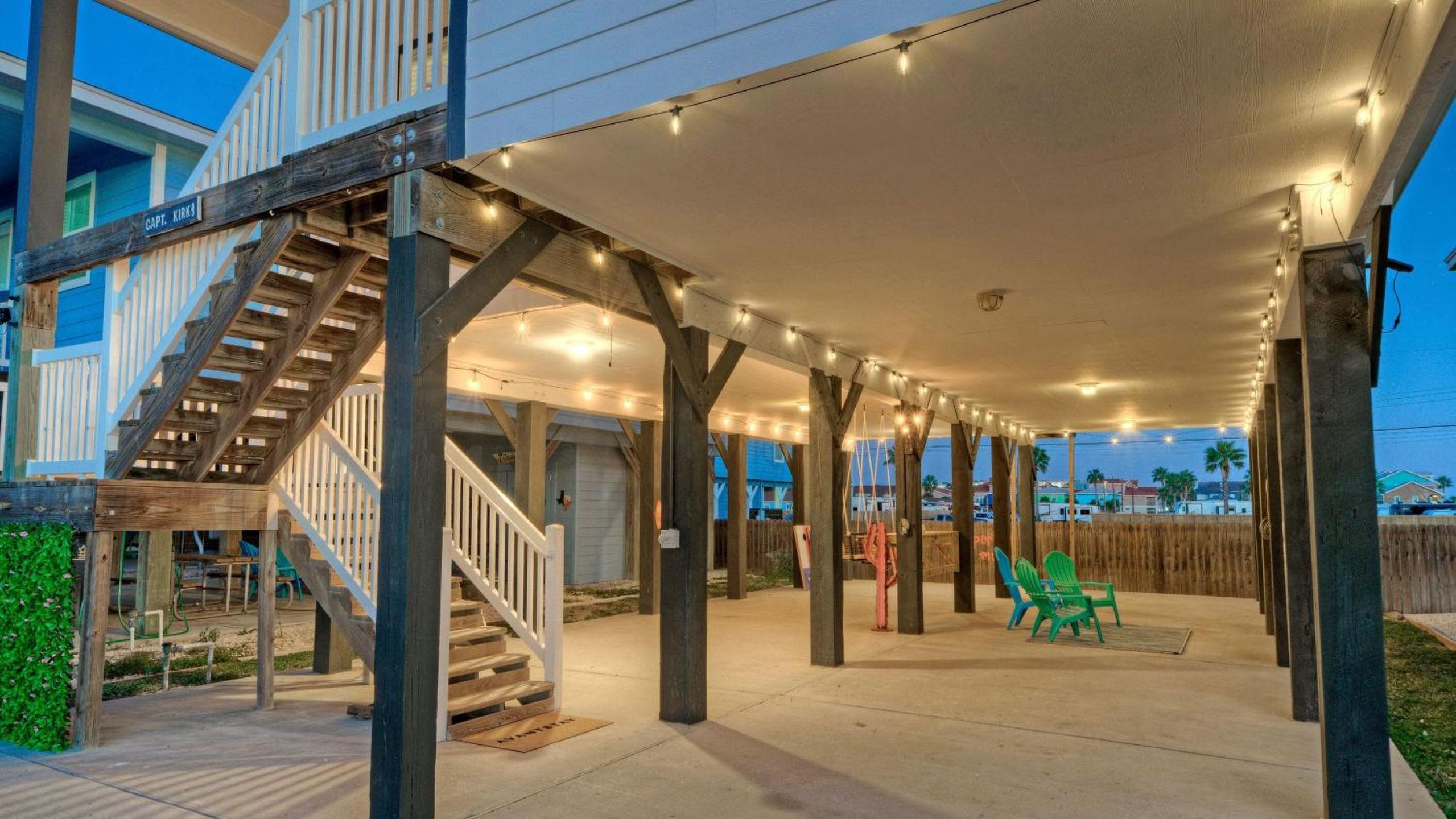 Bright Coastal Escape w Games Swing Chairs Minutes to Port A Beach Captain Kirk by AvantStay