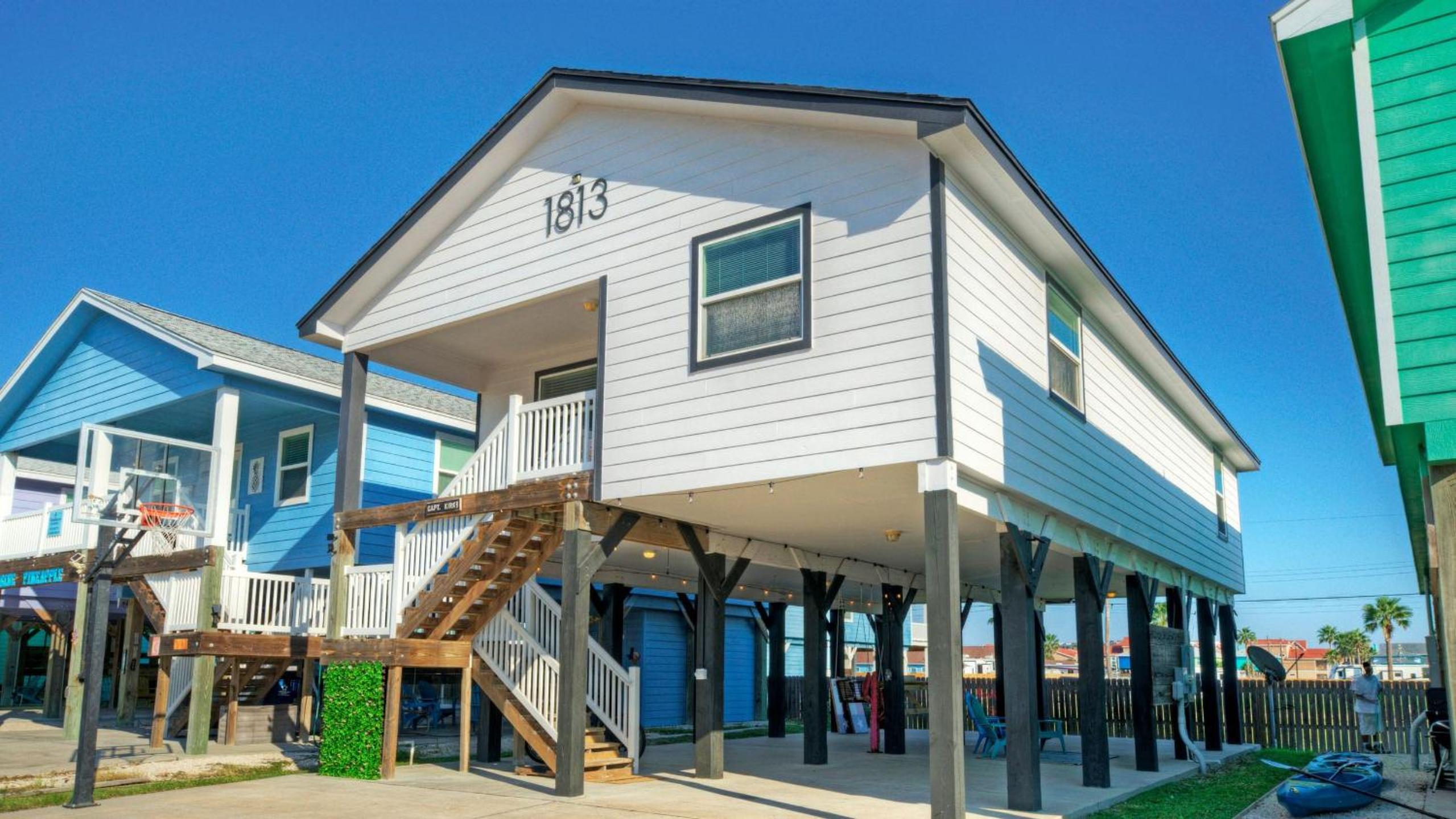 Bright Coastal Escape w Games Swing Chairs Minutes to Port A Beach Captain Kirk by AvantStay
