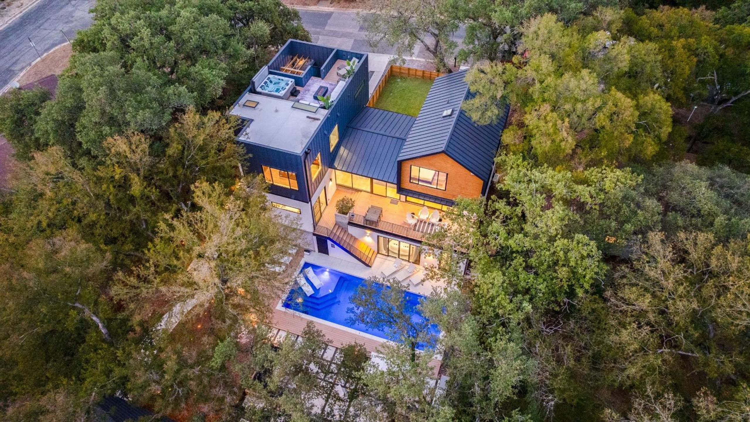 Modern Oasis w Pool Hot Tub Rooftop Deck Home Theater Mariposa Retreat by AvantStay
