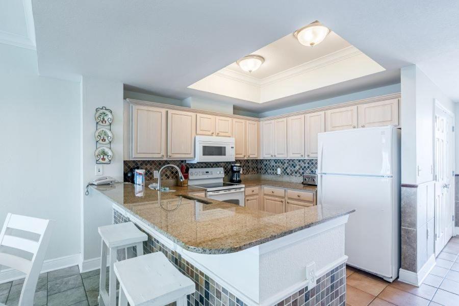 Crystal Shores West 1005 by Youngs Suncoast