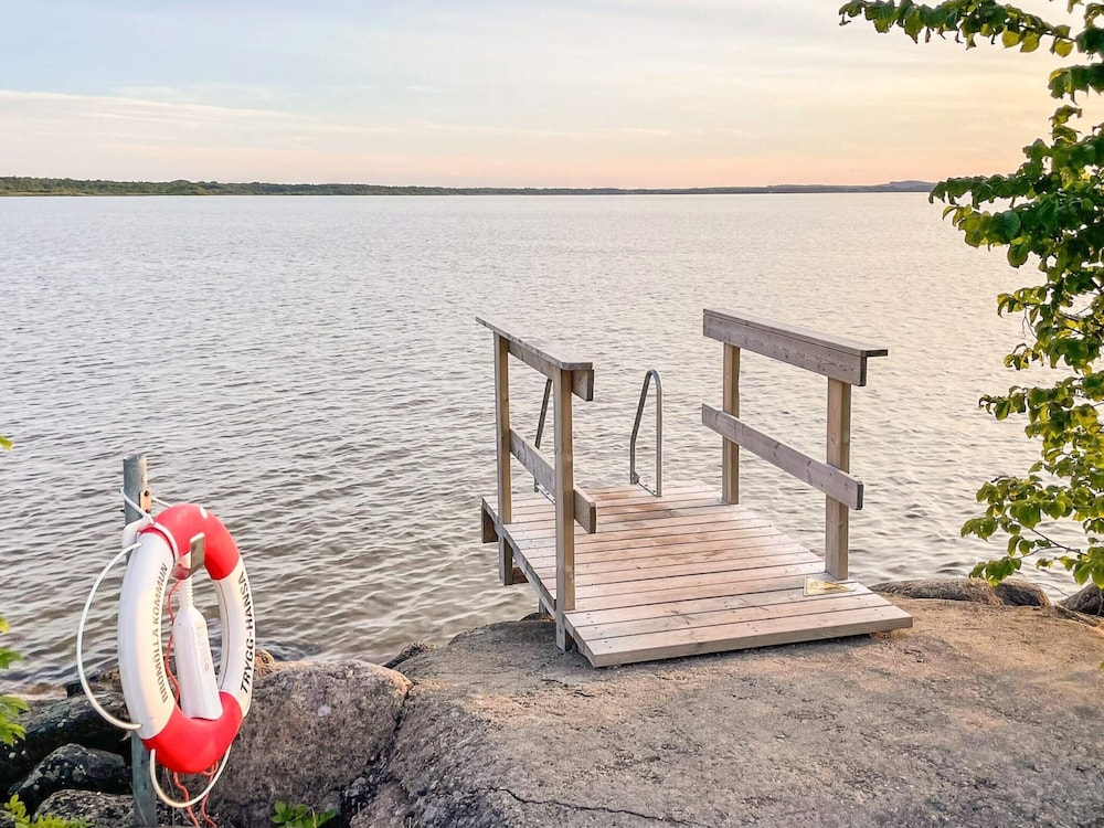 Serene Lakehouse With Rowing Boat