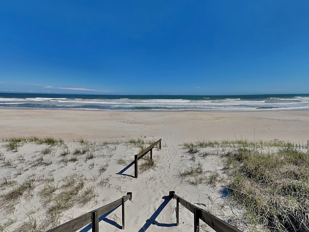 Blue Me A Wave by Topsail Realty