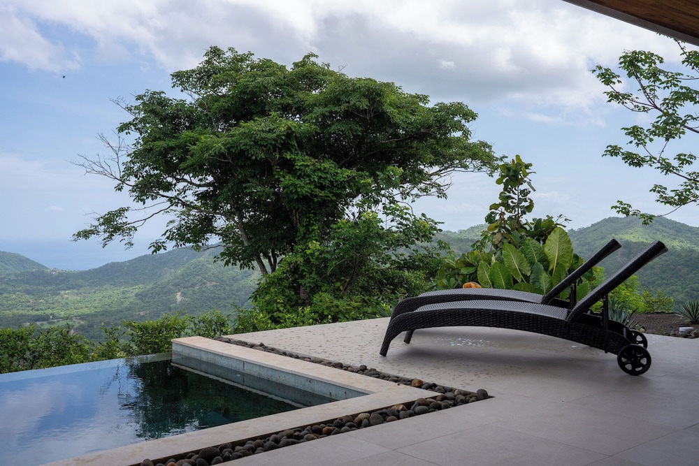 Mountainside Home with Modern Design, Sweeping Ocean Views & Private Swimming Pool