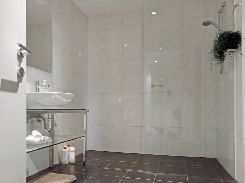 Unwind in Style at Melbourne's Historic Art Deco Apartment With Pool Gym Carpark