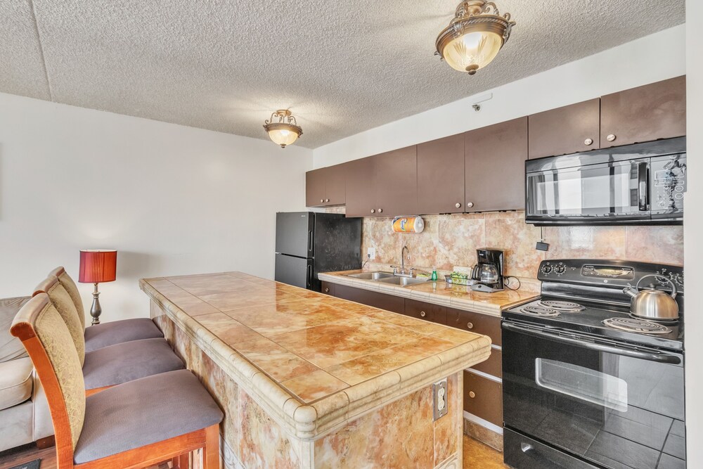 Waikiki Banyan Condo Located One Block From Waikiki Beach! by Koko Resort Vacation Rentals