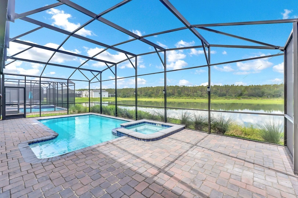 Serenity Lakeview Retreat Stunning Water Views, No Rear Neighbors, Private Pool, Game Room & Star Wars Cinema