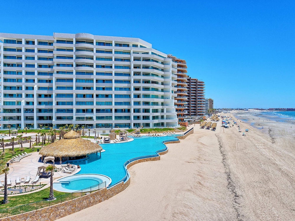 Brand-new Modern 2BR Gem on Iconic Sandy Beach