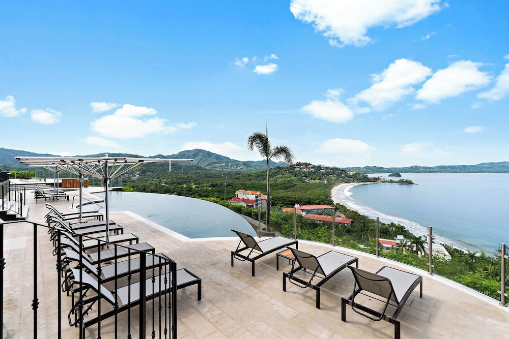 Luxury Condo with Panoramic Ocean Views, Sparkling Infinity Pool, and Modern Open-Concept Design