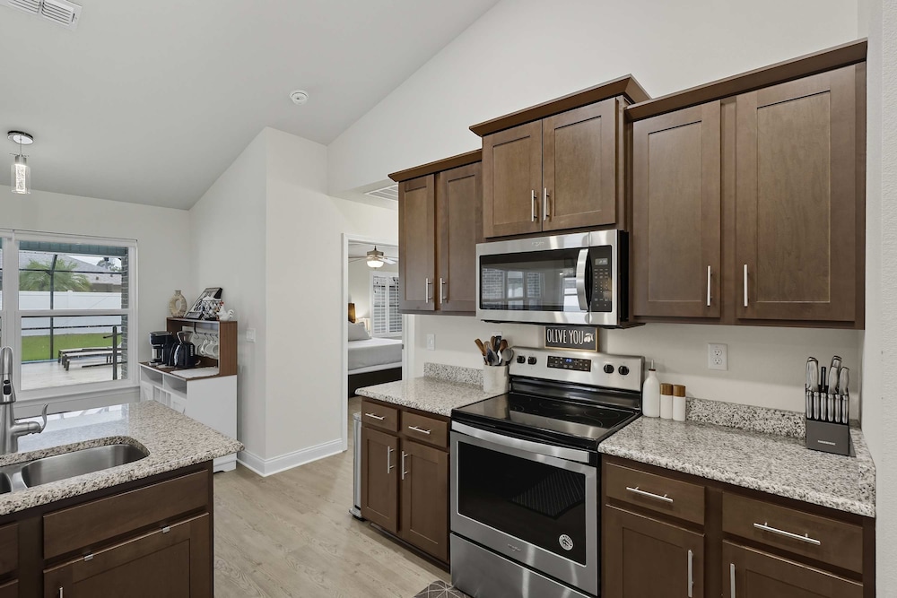 Modern 4BR Retreat Near Beach Heated Pool