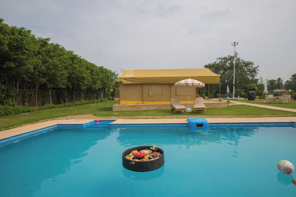 ELIVAAS 5-BHK with Luxe Mudhouses, Tents, Pond & Pvt Pool | Kaimalgarh Farmstay