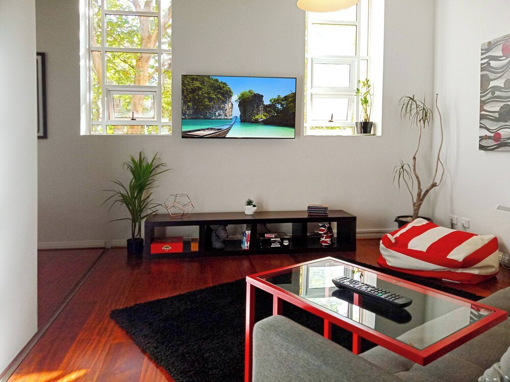 Unwind in Style at Melbourne's Historic Art Deco Apartment With Pool Gym Carpark