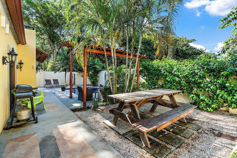Inviting Home with Colorful Decor and Private Backyard Oasis with a Swimming Pool & Shaded Terrace