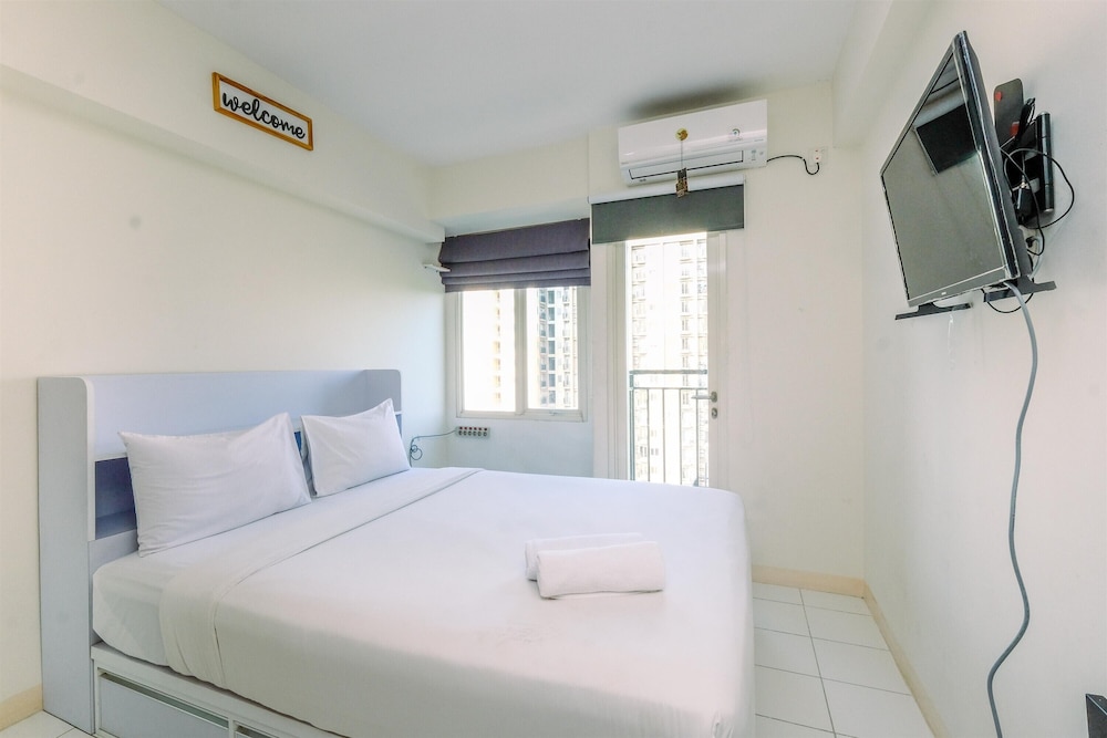 Warm and Cozy Design Studio at Podomoro Golf View Apartment