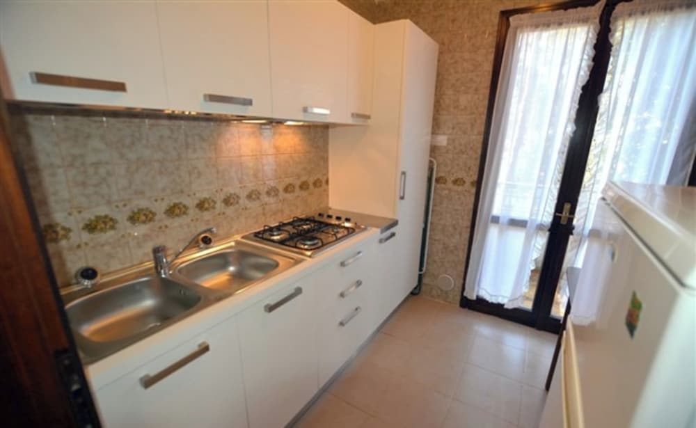 Wide row House With Private Fenced Garden for 9 Guests in Lignano Pineta