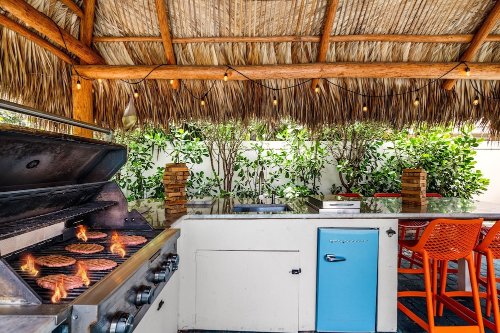 Eccentric Home With Pool Tiki hut Outdoor Kitchen