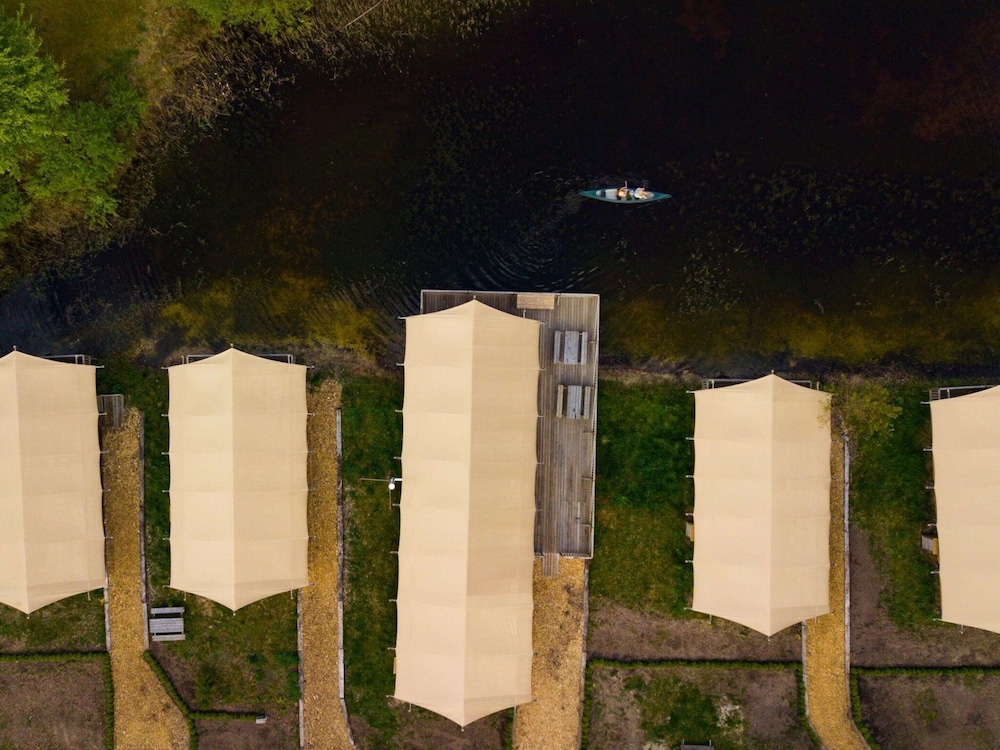 Campsite - Combined Tents With Kitchen and Bathroom Located Near a Pond