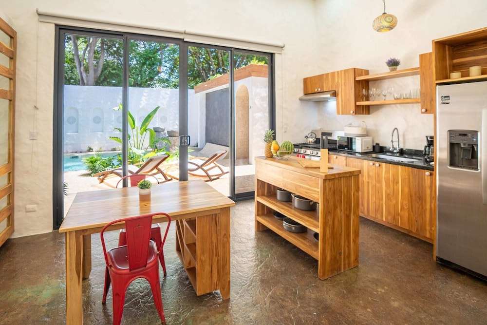 Bohemian Tropical Villa with a Tiki-Style Swimming Pool & Swim-Up Bar with an Attached Studio Apartment