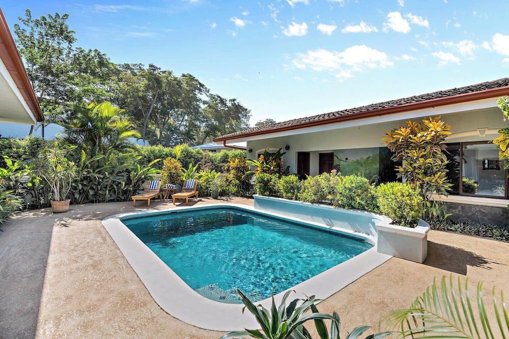 Stylish Home with Chic Decor, Luxury Amenities & Tropical Outdoor Oasis with Sparkling Private Pool