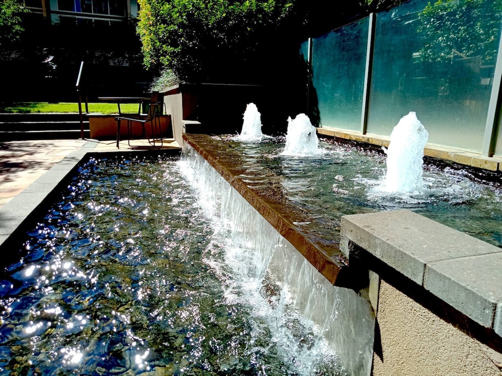 Unwind in Style at Melbourne's Historic Art Deco Apartment With Pool Gym Carpark