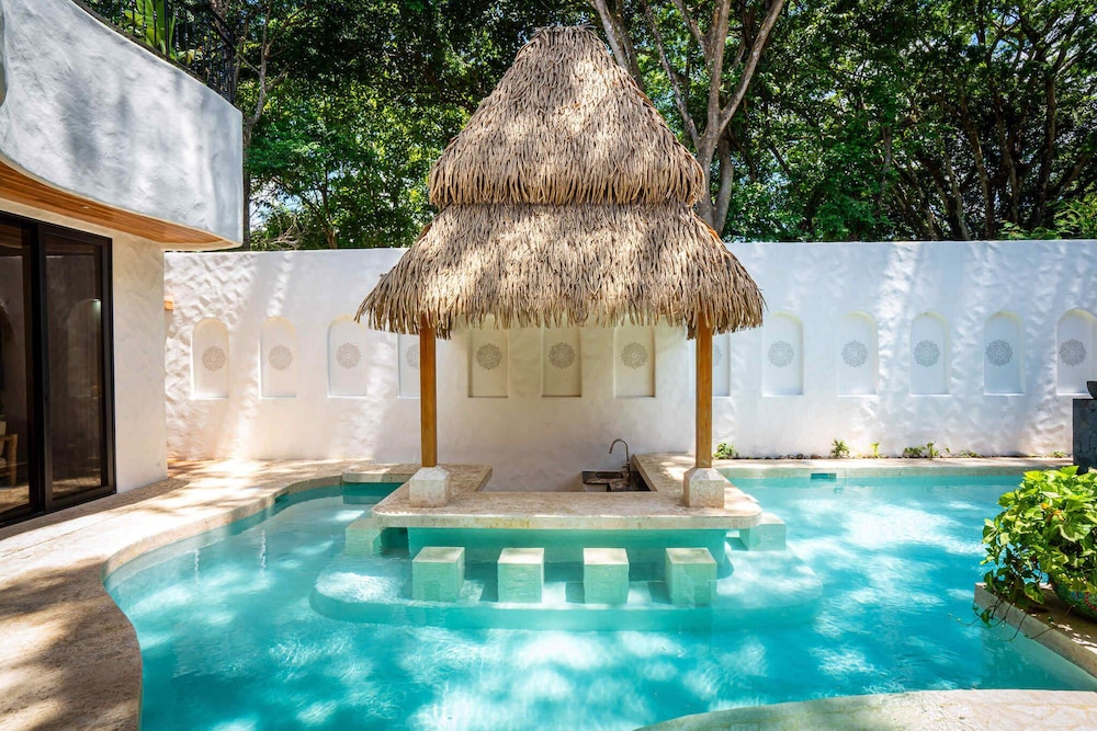 Bohemian Tropical Villa with a Tiki-Style Swimming Pool & Swim-Up Bar with an Attached Studio Apartment