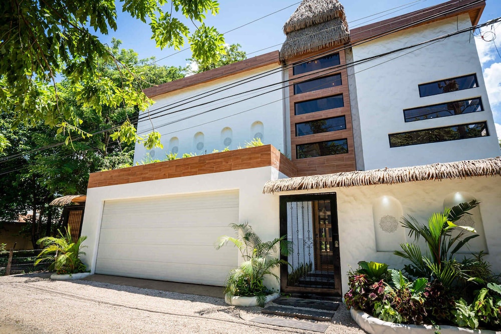 Bohemian Tropical Villa with a Tiki-Style Swimming Pool & Swim-Up Bar with an Attached Studio Apartment