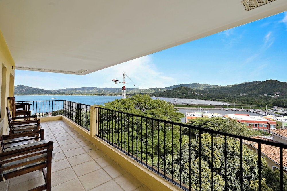 Remodeled Top-Floor Condo with Stunning Wrap-Around Balcony Offering Mountain, Ocean & Marina Views