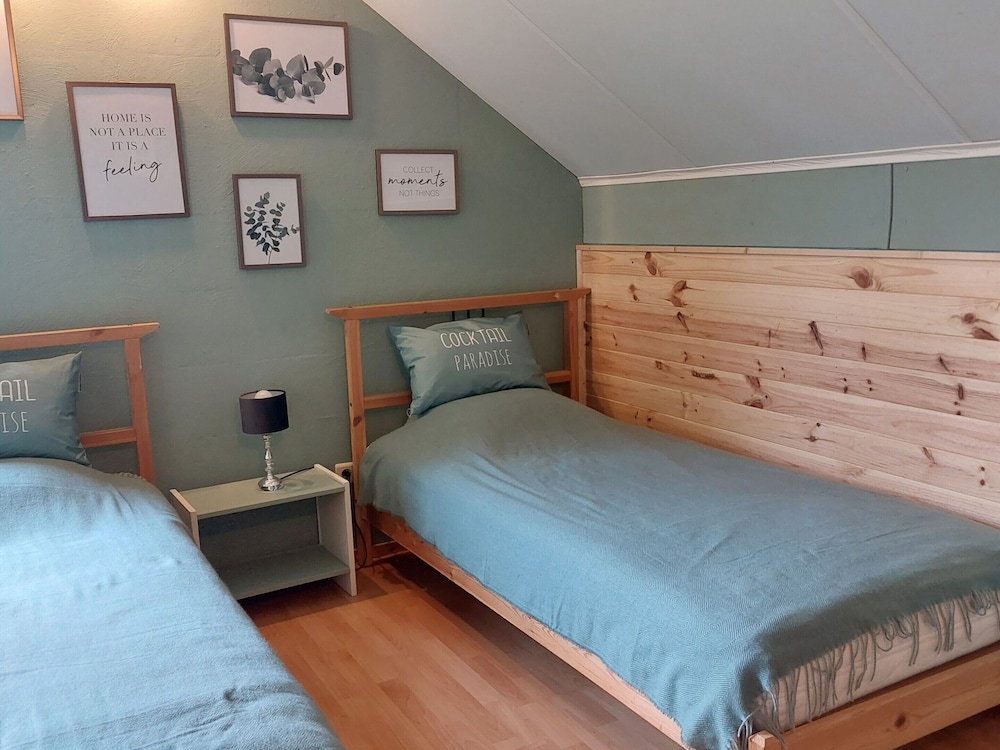Rustic Holiday Home with Sauna & Hot Tub in Wooded Area view 2