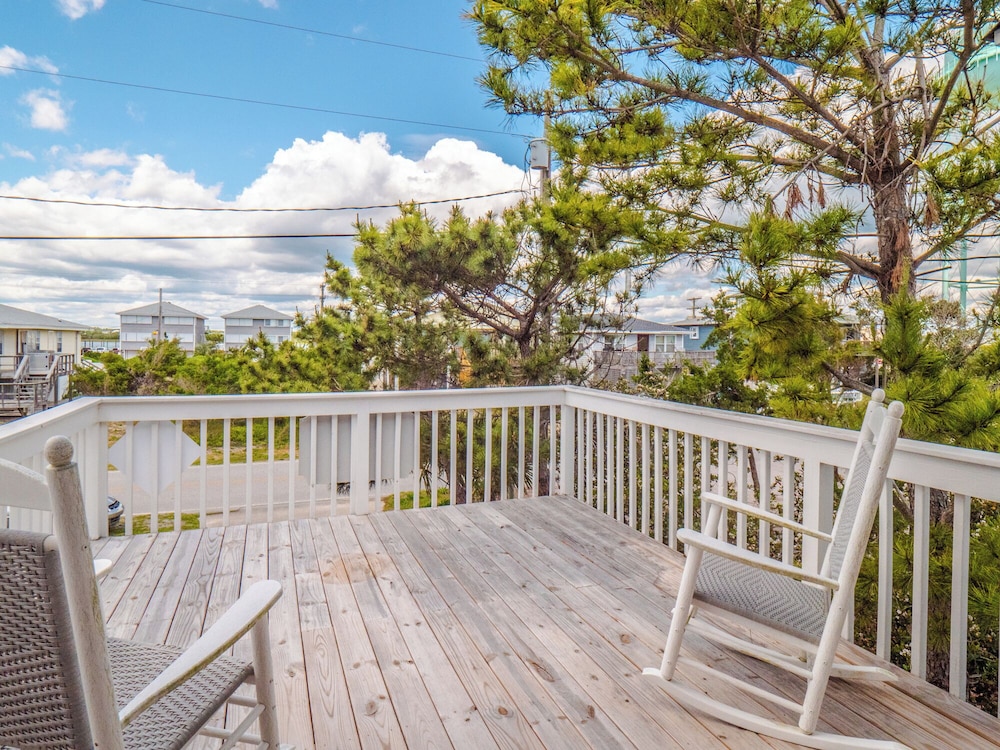 A Charm of Finches by Topsail Realty