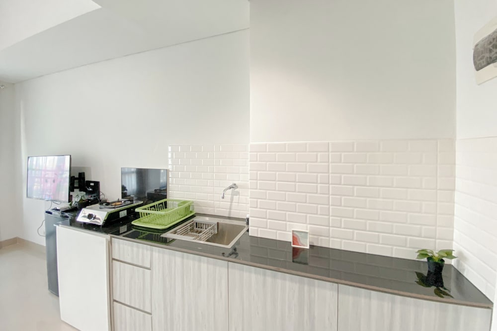 Simple White Designed Studio At Lrt City Bekasi Apartment