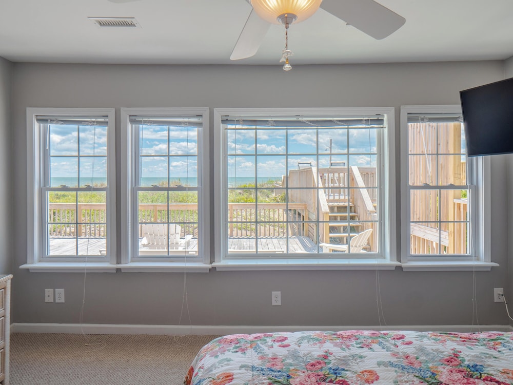 A Charm of Finches by Topsail Realty
