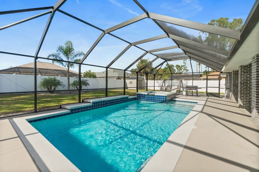 Modern 4BR Retreat Near Beach Heated Pool