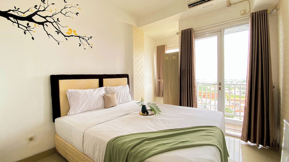Homey And Cozy Living Studio At Poris 88 Apartment