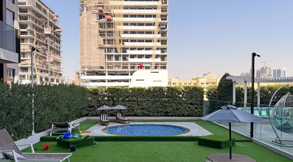Stylish 1BR Apt w Pool in JVC nr Dubai Sports City