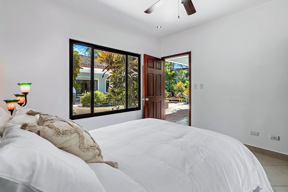 Stylish Home with Chic Decor, Luxury Amenities & Tropical Outdoor Oasis with Sparkling Private Pool