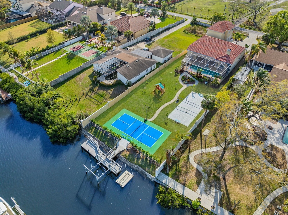Waterfront Pool Pickleball Court Game Room
